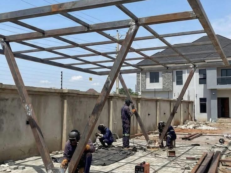 Steel carport structure under construction by The Classic Forge