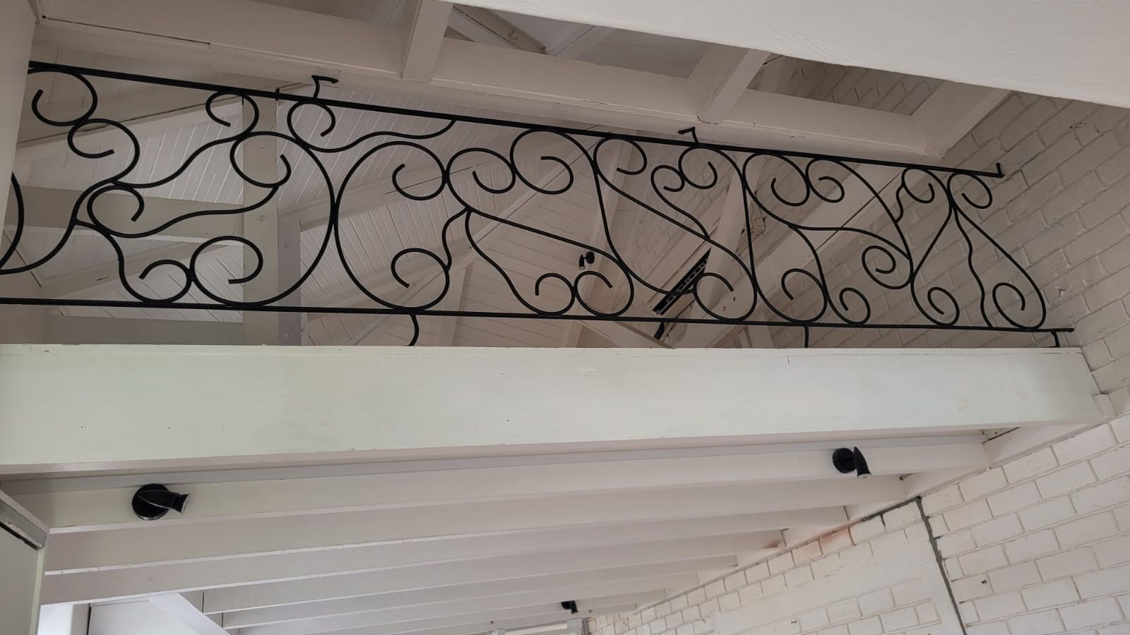 Finished wrought iron scrollwork balustrade by The Classic Forge