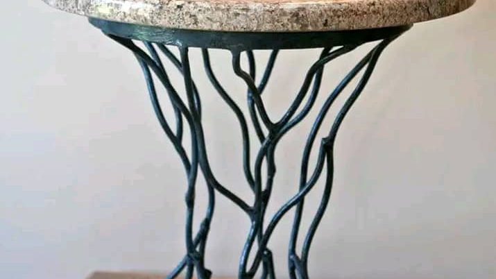 Custom steel and stone side table by The Classic Forge